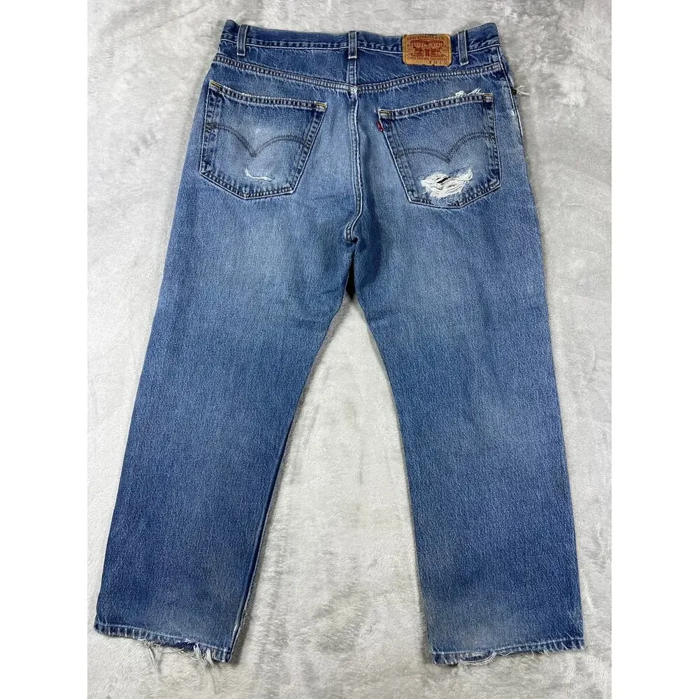 Vintage Levi's 550 Distressed Jeans 38x30 Made in USA Light Wash